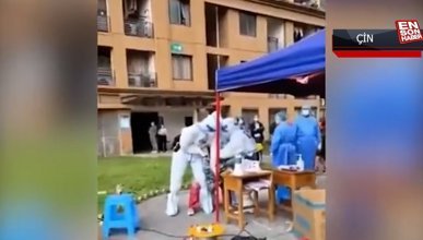 Çin'de sağlık görevlileri, kadına sokak ortasında anal test yaptı