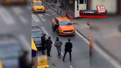 Beyoğlu'nda araçların önünü kesip taksi kaputunun üzerine yattı