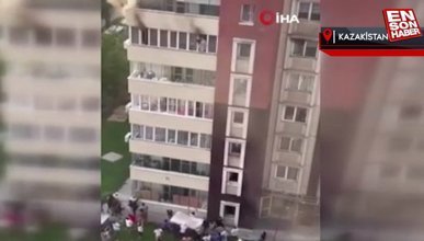 Yangından kaçan kadın ve çocuk metrelerce yüksekten aşağı atladı