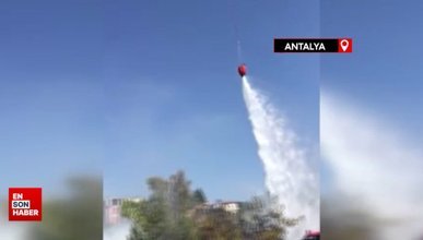 Antalya'da çöp dökülen alandaki yangına helikopterle müdahale edildi