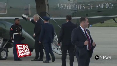 Trump askerin rüzgardan uçan şapkasını kovaladı