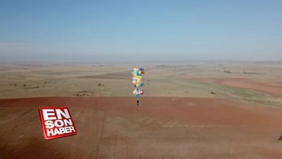Uçan balonlarla 25 kilometre uçtu