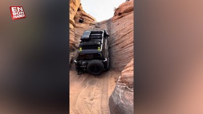 Dik kayaya tırmanan araba