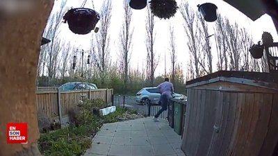 Kapının üstünden atlarken düşen adam kamerada