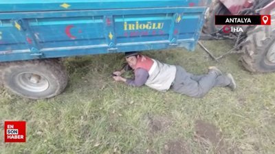 Antalya'da dron korkusuyla traktörün altına saklanan baba