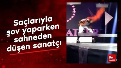 Saçlarıyla şov yaparken sahneden düşen sanatçı