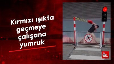 Kırmızı ışıkta geçmeye çalışana yumruk