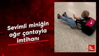 Sevimli miniğin ağır çantayla imtihanı