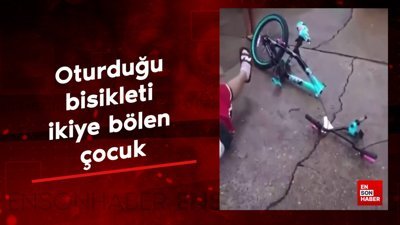 Oturduğu bisikleti ikiye bölen çocuk
