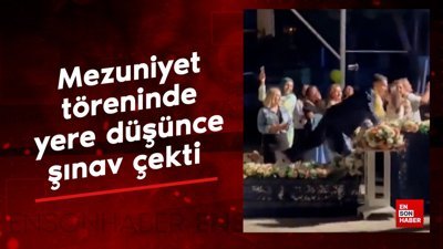 Mezuniyet töreninde yere düştü şınav çekti