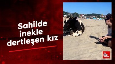 Sahilde inekle dertleşen kız