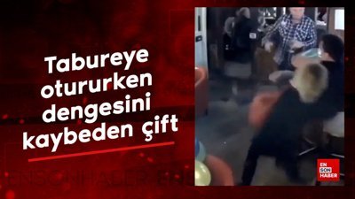 Tabureye otururken dengesini kaybeden çift