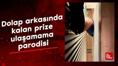 Dolap arkasında kalan prize ulaşamama parodisi
