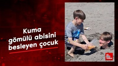Kuma gömülü abisini besleyen çocuk