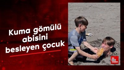 Kuma gömülü abisini besleyen çocuk
