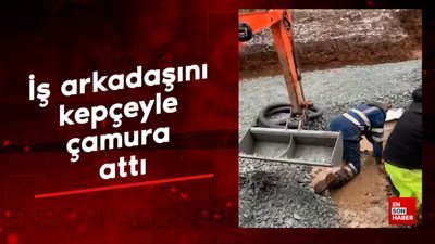 İş arkadaşını kepçeyle çamura attı