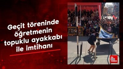 Geçit töreninde öğretmenin topuklu ayakkabılarla yaşadığı zorluk