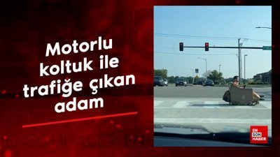 Motorlu koltuk ile trafiğe çıkan adam