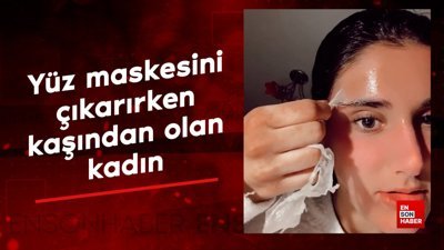 Yüz maskesini çıkarırken kaşından olan kadın
