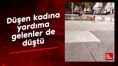 Düşen kadına yardıma gelenler de düştü