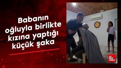 Babanın oğluyla birlikte kızına yaptığı küçük şaka