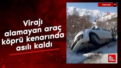 Hakkari'de virajı alamayan araç köprü kenarında asılı kaldı