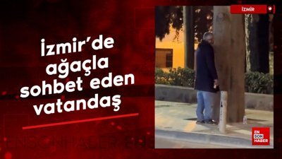 İzmir'de ağaçla sohbet eden vatandaş
