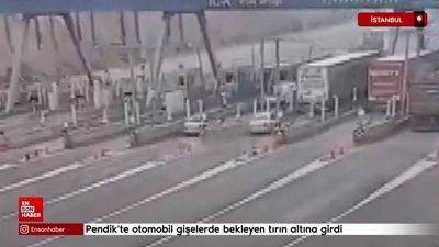 Pendik'te otomobil gişelerde bekleyen tırın altına girdi
