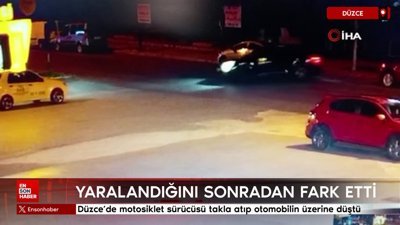 Düzce'de motosiklet sürücüsü takla atıp otomobilin üzerine düştü