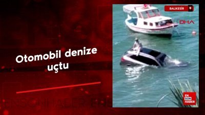 Balıkesir'de otomobil denize uçtu sürücü otomobilin üzerinde oturup yardım bekledi