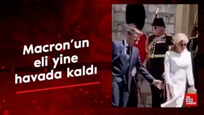 Macron eşinin elini tutmak istedi: Eli yine havada kaldı