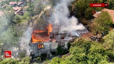 Karabük'ta otluk alanda sıçrayan yangın iki katlı evi kül etti