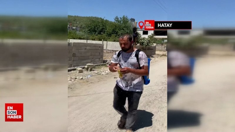 Hatay'da 50 dereceyi bulan sıcakta, başında duş başlığıyla gezdi