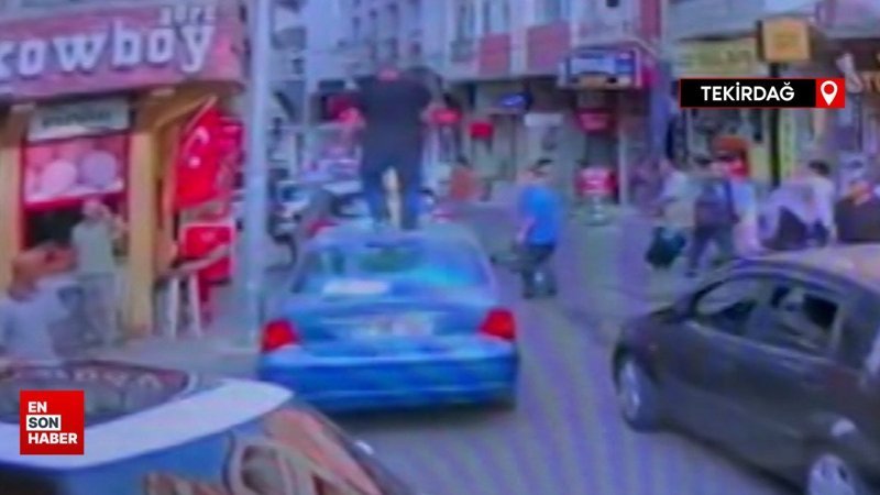 Kavga ettiği kişinin otomobilinin üzerine çıkıp camlarını kırdı