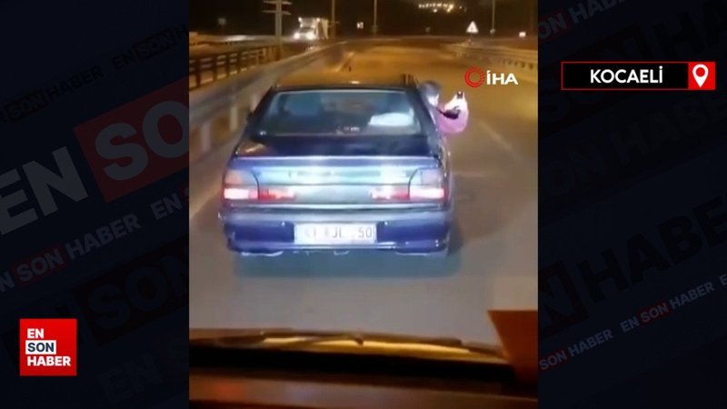 Kocaeli'de canını hiçe saydı: Aracın kapısı açık ilerledi