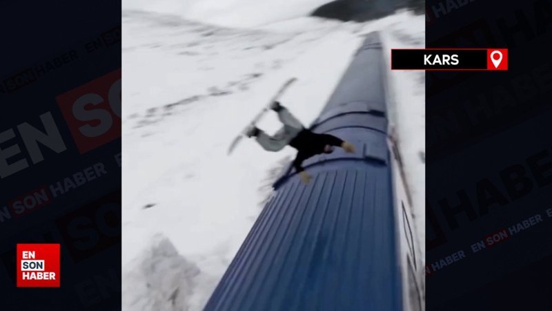 Snowboardla Doğu Ekspresi'nin üzerinden atladı