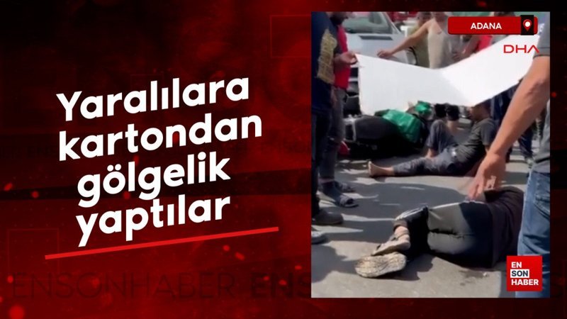 Adana'da kaza yapan yaralılara kartondan gölgelik yaptılar