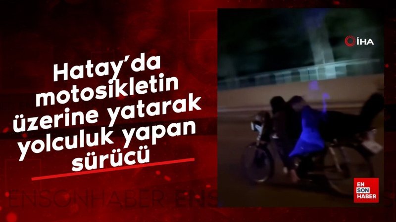 Hatay’da trafikte motosikletin üzerine yatarak yolculuk yapan sürücü